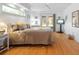 Main bedroom with hardwood floors and sliding glass doors at 3298 Branch Creek Dr, Sarasota, FL 34235