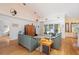 Living room with hardwood floors, vaulted ceiling and sliding doors to patio at 3298 Branch Creek Dr, Sarasota, FL 34235