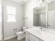 Clean bathroom with a vanity, toilet, and shower at 3411 Dryden St, North Port, FL 34288