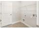 Laundry room with hookups and shelving at 3411 Dryden St, North Port, FL 34288