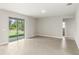 Spacious living area with sliding glass doors at 3411 Dryden St, North Port, FL 34288