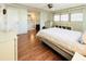 Spacious bedroom with hardwood floors, ceiling fan and ensuite bathroom at 3411 Spanish Oak Ter, Sarasota, FL 34237