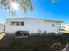 White single-wide manufactured home with AC unit at 3411 Spanish Oak Ter, Sarasota, FL 34237