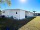 White manufactured home with covered patio at 3411 Spanish Oak Ter, Sarasota, FL 34237