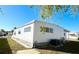 White single-wide manufactured home with AC unit at 3411 Spanish Oak Ter, Sarasota, FL 34237