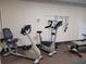 Fitness center with recumbent bikes and weight training equipment at 3411 Spanish Oak Ter, Sarasota, FL 34237