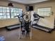 Well-equipped fitness center featuring treadmills, elliptical trainers, and strength machines at 3411 Spanish Oak Ter, Sarasota, FL 34237