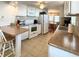 Kitchen with white cabinets and brown countertops at 3411 Spanish Oak Ter, Sarasota, FL 34237