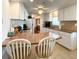 Kitchen with white cabinets and brown countertops at 3411 Spanish Oak Ter, Sarasota, FL 34237