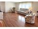 Living room with hardwood floors and comfy seating at 3411 Spanish Oak Ter, Sarasota, FL 34237