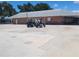 Community parking lot with golf carts at 3411 Spanish Oak Ter, Sarasota, FL 34237