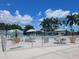 Community pool area with seating and umbrellas at 3411 Spanish Oak Ter, Sarasota, FL 34237