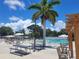 Relaxing pool area with pergola and lounge chairs at 3411 Spanish Oak Ter, Sarasota, FL 34237