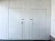 Two white storage doors with handles, ideal for extra storage at 3411 Spanish Oak Ter, Sarasota, FL 34237