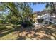 Backyard with grill and patio, shaded by trees at 3640 41St S Ln # F, St Petersburg, FL 33711