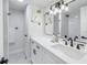 Modern bathroom with white cabinets and black matte fixtures at 3640 41St S Ln # F, St Petersburg, FL 33711