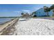 Private beach access with tiki hut and lounge chairs at 3640 41St S Ln # F, St Petersburg, FL 33711