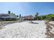 Beachfront view with picnic table under a palapa at 3640 41St S Ln # F, St Petersburg, FL 33711