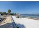 Beach access with picnic area, waterfront views, and sandy shoreline at 3640 41St S Ln # F, St Petersburg, FL 33711