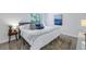 King-size bed in bright bedroom with blue and white accents at 3640 41St S Ln # F, St Petersburg, FL 33711