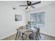 Light and bright dining area with a wooden table and seating for four at 3640 41St S Ln # F, St Petersburg, FL 33711