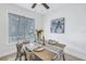 Dining room featuring wooden table, four chairs, and coastal artwork at 3640 41St S Ln # F, St Petersburg, FL 33711