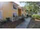 Building exterior showcasing yellow walls and landscaping at 3640 41St S Ln # F, St Petersburg, FL 33711