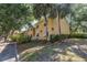 Building exterior showcasing yellow walls and landscaping at 3640 41St S Ln # F, St Petersburg, FL 33711