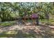 Shaded playground with climbing structures and swings at 3640 41St S Ln # F, St Petersburg, FL 33711