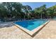 Inviting community pool with ample lounge chairs at 3640 41St S Ln # F, St Petersburg, FL 33711