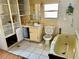 Dated bathroom with bathtub, toilet and shelving at 3710 Gulf Of Mexico Dr # G-6, Longboat Key, FL 34228