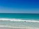 Ocean waves rolling onto sandy shore at 3710 Gulf Of Mexico Dr # G-6, Longboat Key, FL 34228