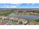 Community overview featuring a lake and numerous houses at 3713 Savanna Palms Ct, Bradenton, FL 34211