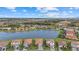 Community overview featuring a lake and numerous houses at 3713 Savanna Palms Ct, Bradenton, FL 34211