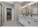 Modern bathroom with double vanity and walk-in shower at 3713 Savanna Palms Ct, Bradenton, FL 34211