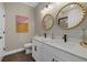 Elegant bathroom with double vanity and gold-accented mirrors at 3713 Savanna Palms Ct, Bradenton, FL 34211