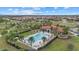 Community pool and clubhouse with surrounding landscaping at 3713 Savanna Palms Ct, Bradenton, FL 34211