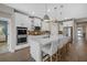 Modern kitchen with white cabinets, large island and stainless steel appliances at 3713 Savanna Palms Ct, Bradenton, FL 34211