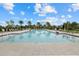 Refreshing community pool with plenty of lounge chairs at 3713 Savanna Palms Ct, Bradenton, FL 34211