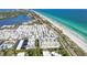 An impressive aerial view of a beachside community near the Gulf of Mexico at 3810 Gulf Of Mexico Dr # F105, Longboat Key, FL 34228