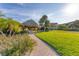 Beautiful common area with lush greenery, a gazebo, and walking paths for enjoyable outdoor activities at 3810 Gulf Of Mexico Dr # F105, Longboat Key, FL 34228