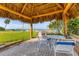 Charming tiki hut area with seating and a view of the marina. Ideal for relaxation and socializing at 3810 Gulf Of Mexico Dr # F105, Longboat Key, FL 34228