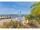 Lovely picnic spot featuring tables, umbrellas, and beautiful views of the marina and waterway at 3810 Gulf Of Mexico Dr # F105, Longboat Key, FL 34228