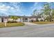 Front view of a condo with landscaping and driveway at 3904 Lakeside Rd # 174, Sarasota, FL 34232