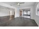 Bright living room with polished concrete floors and sliding glass doors leading to a screened porch at 3904 Lakeside Rd # 174, Sarasota, FL 34232