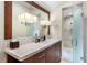 Elegant bathroom with a large vanity, a walk-in shower, and modern fixtures at 3930 Red Rock Way, Sarasota, FL 34231