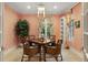 Charming game room with patterned walls and wicker furniture at 3930 Red Rock Way, Sarasota, FL 34231