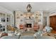 Elegant living room featuring a fireplace, built-in shelving, and comfortable seating at 3930 Red Rock Way, Sarasota, FL 34231