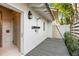 Private outdoor shower with a deck and lush landscaping at 3930 Red Rock Way, Sarasota, FL 34231