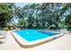 Community pool with surrounding lounge chairs at 401 Spring Lakes Blvd # 401, Bradenton, FL 34210